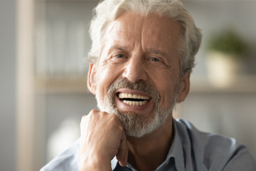 Close-up of a senior man laughing and smiling