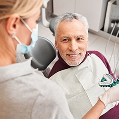 A man taking dental impressions for dentures