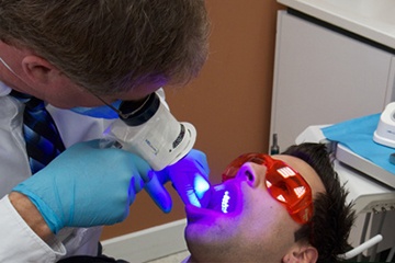 Patient receiving VELScope oral cancer screening