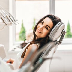 Young woman in dentist’s chair