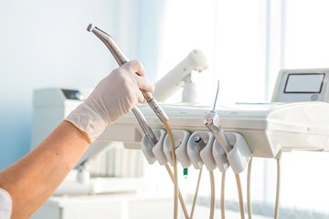 dentist putting away professional tools