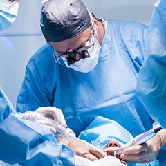 dentists performing dental implant surgery