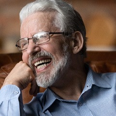 Man with dentures laughing