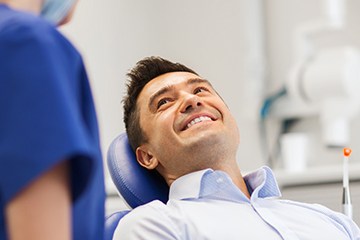 Smiling man in dental chair