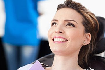 Smiling woman in dental chair