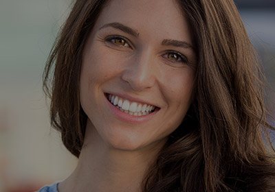 Young woman with straight beautiful smile