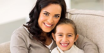 Smiling mother and daughter