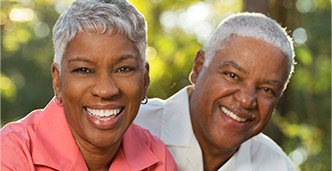 Smiling senior man and woman outdoors