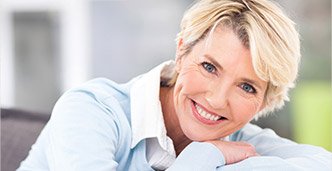 Smiling senior woman with healthy teeth and gums