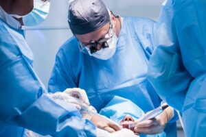 Dentists performing implant surgery.