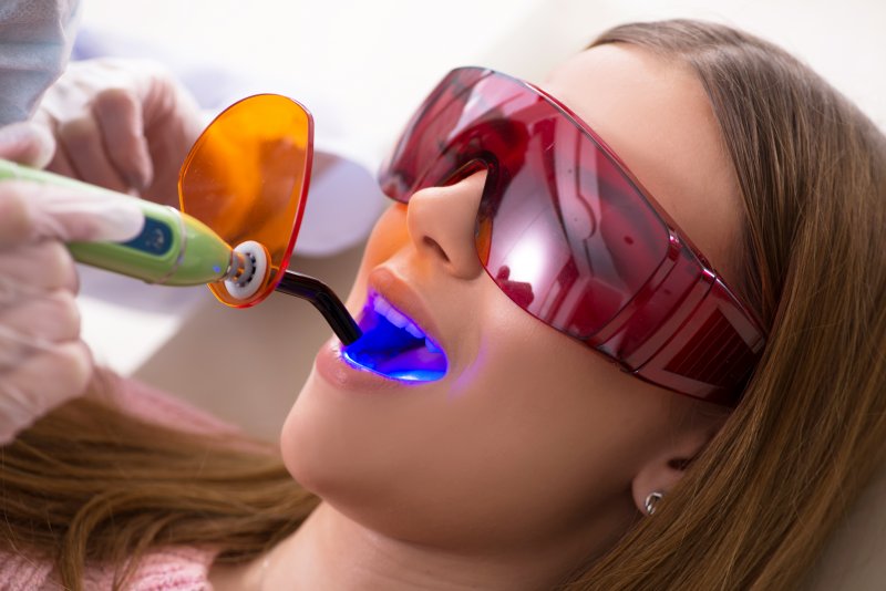 A woman receiving dental fillings