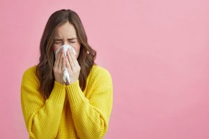 woman who needs oral care tips in cold and flu season