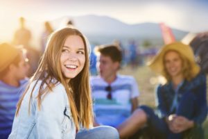 Teens hanging out at beach