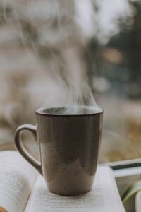 Steaming coffee cup on a book