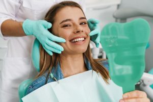 a patient smiling after receiving temporary veneers